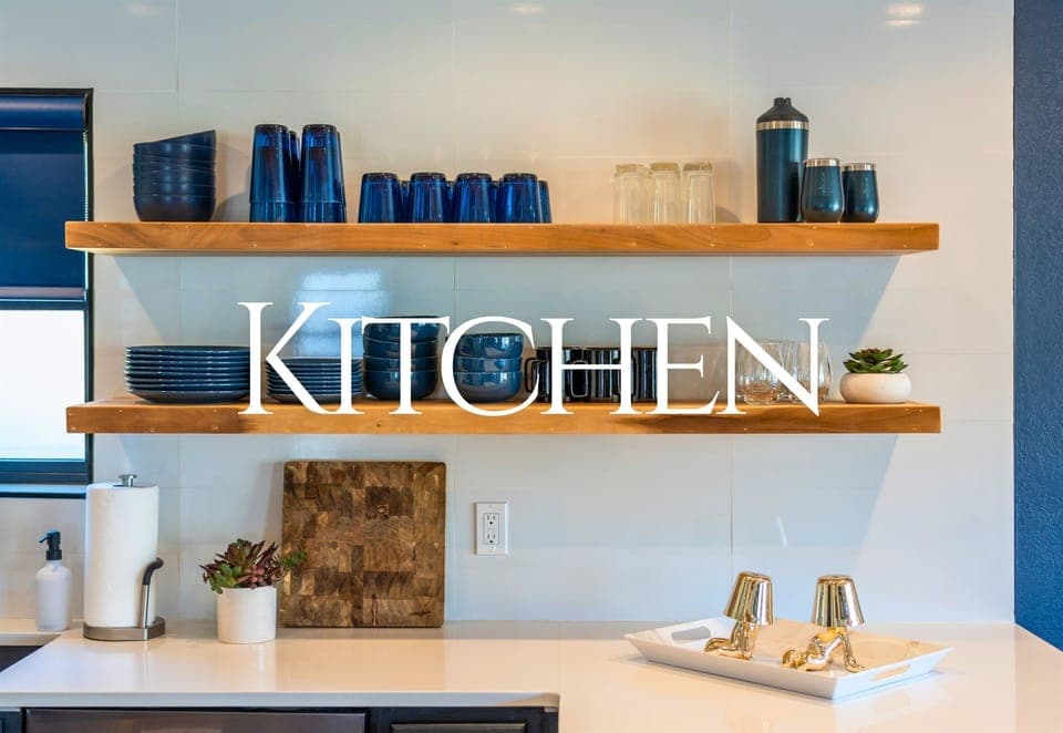 This modern kitchen offers open shelving and sleek finishes, creating the perfect space for preparing meals and enjoying conversation.