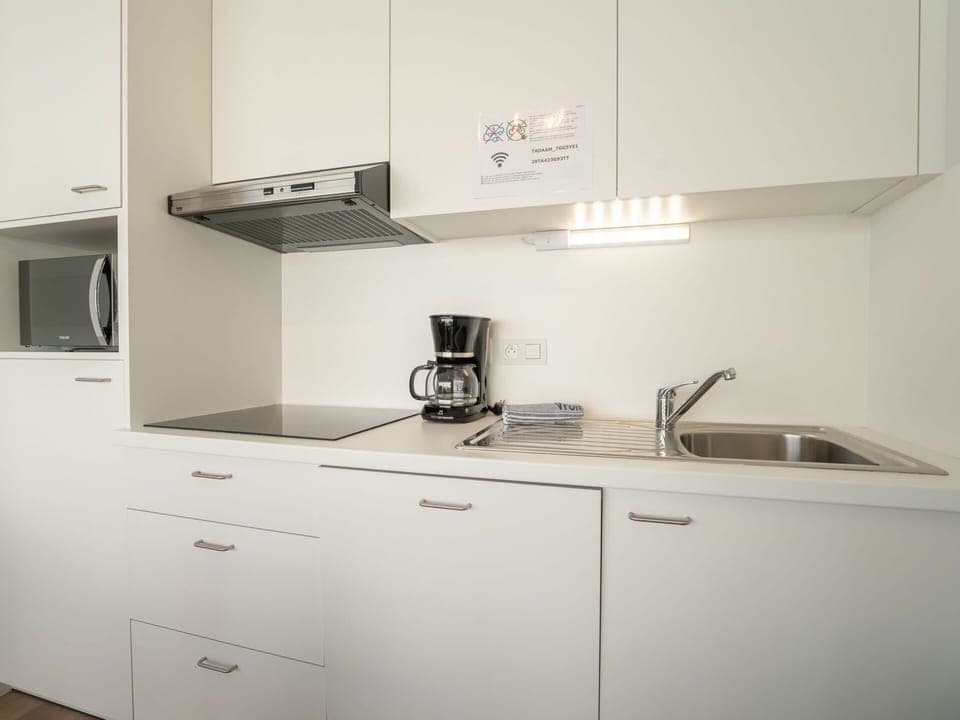 Kitchen, Countertop, Cabinetry, Interior Design, Kitchen Appliance, Wood, Furniture, Flooring, Major Appliance, Sink