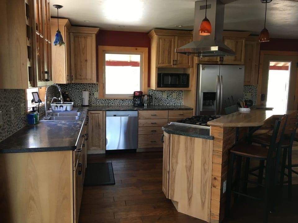 Fully equipped kitchen for all your cooking/baking needs. Bar that seats four.