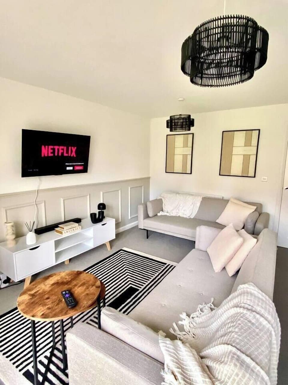 Unwind in this stylish and serene living room—featuring modern decor, and smart TV