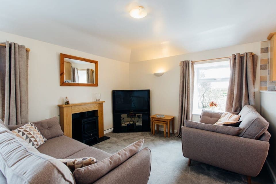 The Hayloft lounge at Trevalgan Farm Holidays