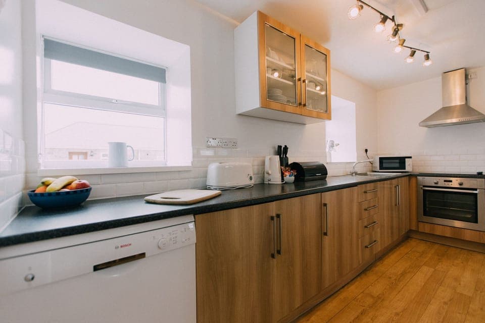 The Carthouse galley style kitchen at Trevalgan Farm Holidays