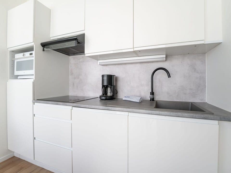 Countertop, Kitchen, Kitchen Appliance, Cabinetry, Flooring, Interior Design, Major Appliance, Floor, Kitchen Sink, Furniture