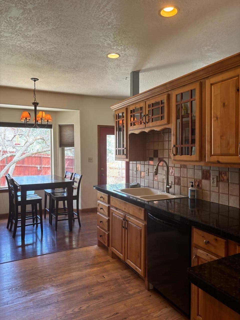 Kitchen, sink and dishwasher opposite side of oven range