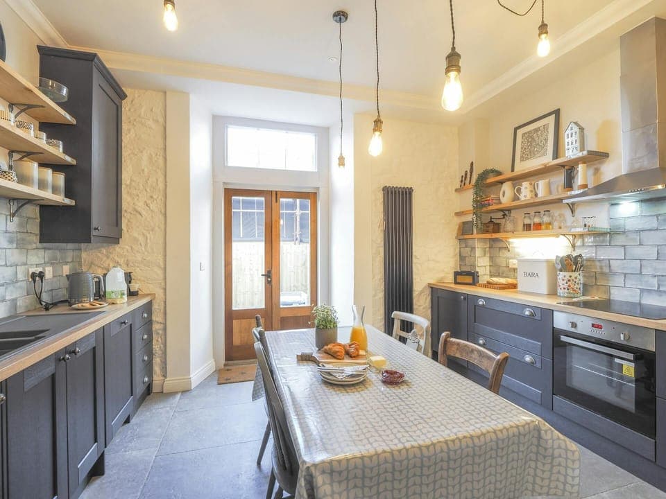kitchen with matching appliances and integrated cooker.