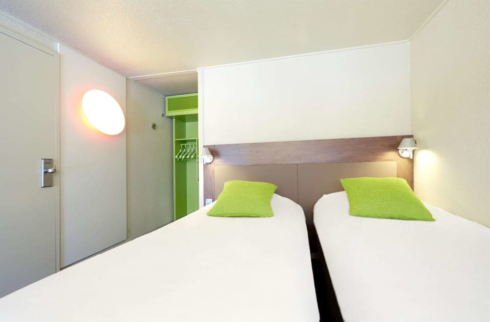 Premium bedding, individually furnished, desk, laptop workspace