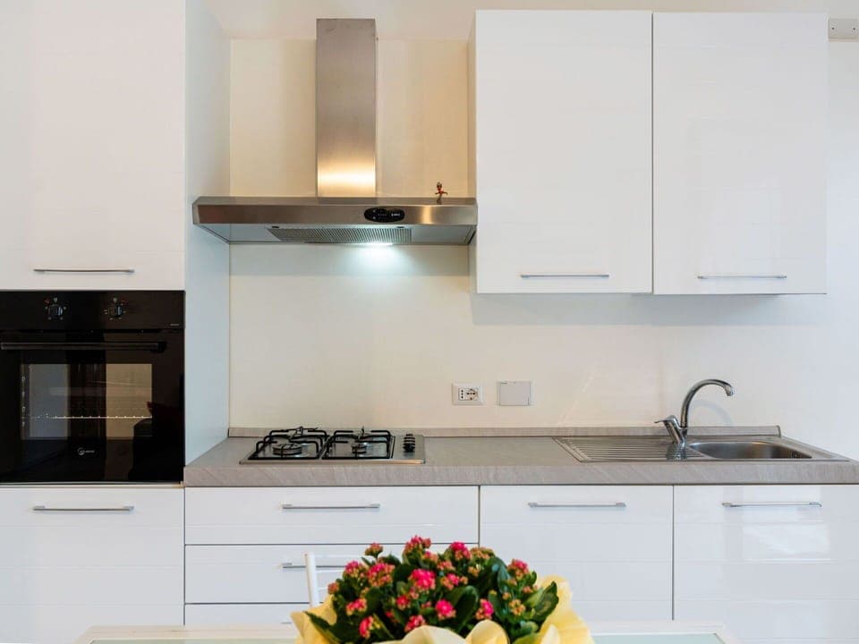 Kitchen, Countertop, Kitchen Appliance, Major Appliance, Cabinetry, Interior Design, Wood, Kitchen Stove, Stove, Home Appliance