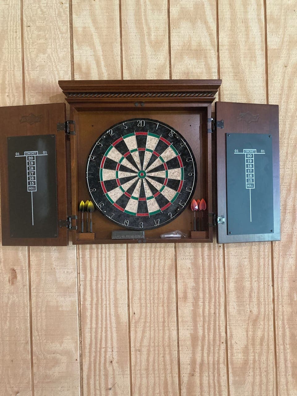 Darts, chalk, and eraser included. Wood walls; don't worry about missing!