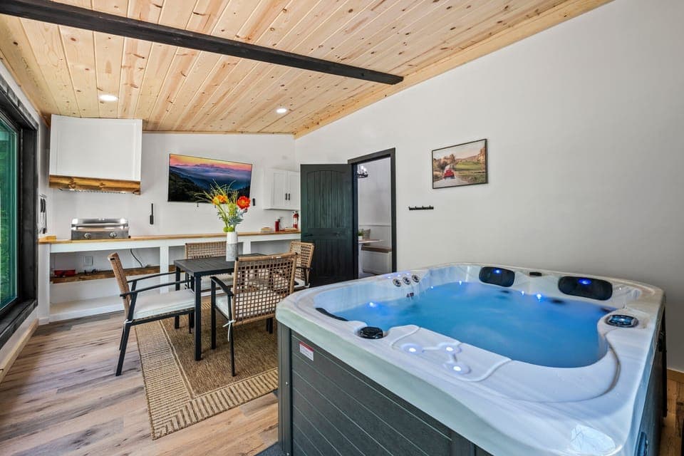 Indulge in a hot tub soak with serene mountain views