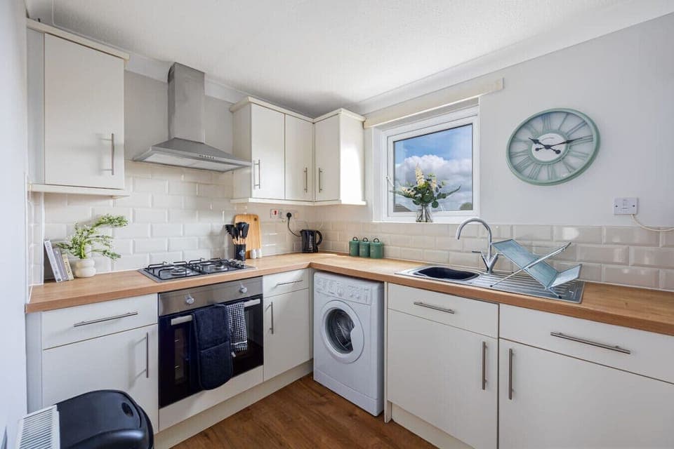 A fully equipped kitchen with all the essentials you need to prepare and enjoy a home-cooked meal.