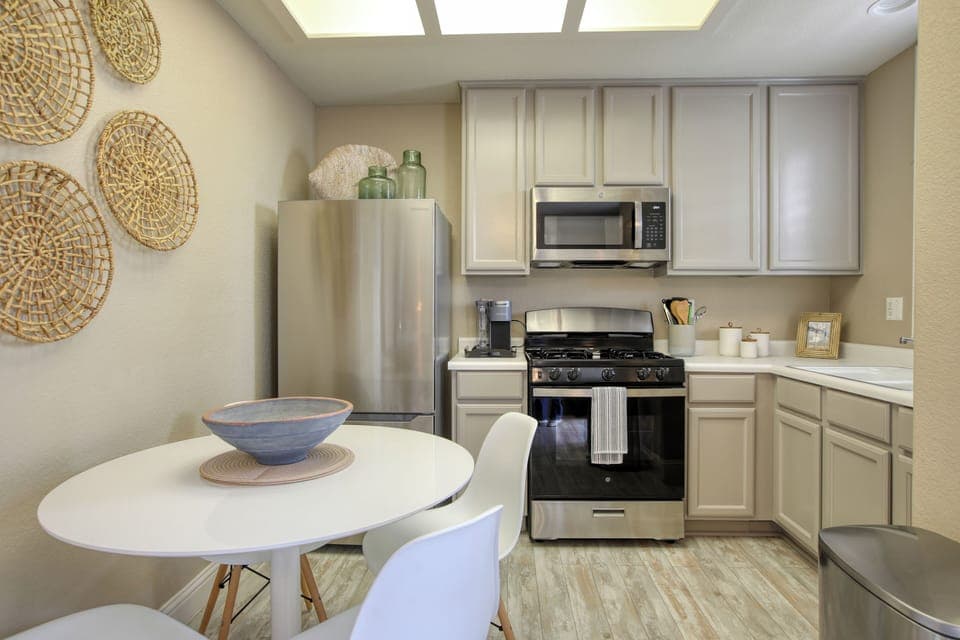 The fully equipped kitchen has a refrigerator, stove and oven, microwave, k-cup coffee maker, and dish ware—everything you need to whip up meals or enjoy a fresh cup of coffee before heading to the beach.