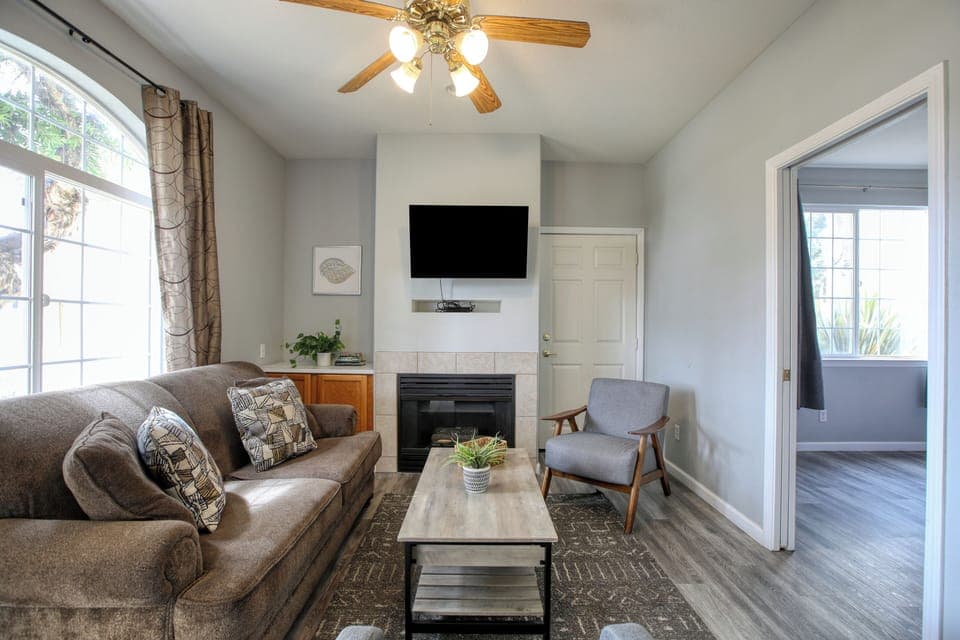 Escape to the coast at Pacific Plaza #604 - Coral Condo. This charming one-bedroom condo features a king bed, sleeper sofa, full kitchen, private patio, and shared hot tub and BBQ access — all just a short stroll from the sun and shore.