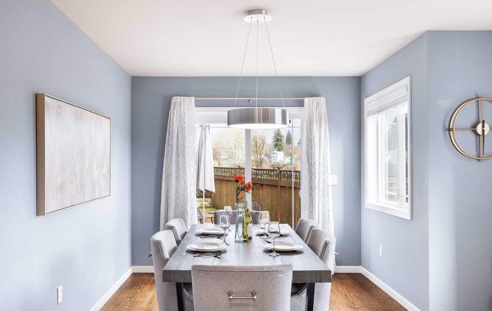 The dinning area is bathed in natural light from large slide door.