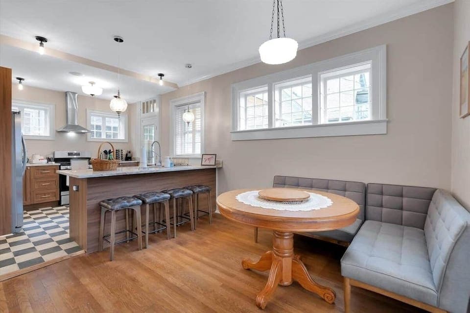 Enjoy two dining spaces to suit your mood—gather casually in the kitchen or savor a more formal meal at the long table in the sunroom. With plenty of options, dining together is an easy decision.
