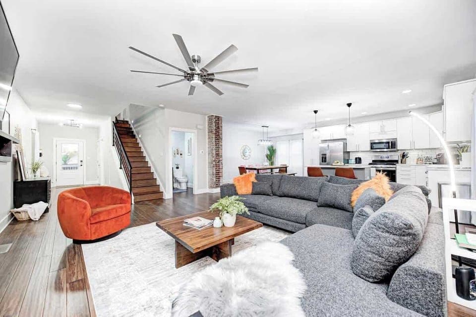 Comfort meets function in this open-layout living room. Enjoy direct access to the fully stocked kitchen and dining area—perfect for easy conversation and shared moments.