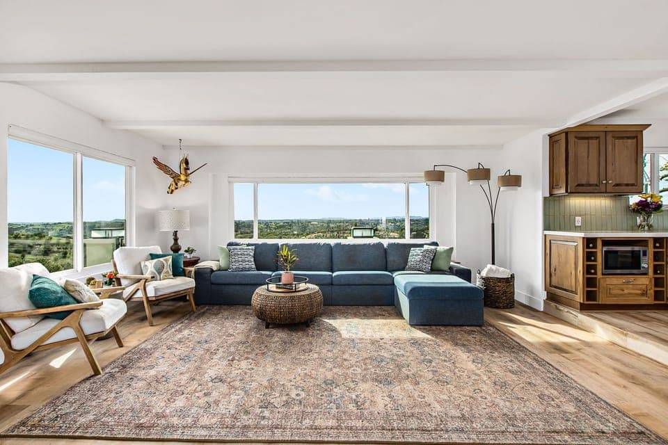 Sun soaked living room with a big screen tv