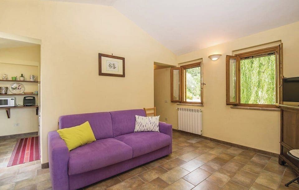 Apartment, Garden View | Living area | 32-inch flat-screen TV with cable channels