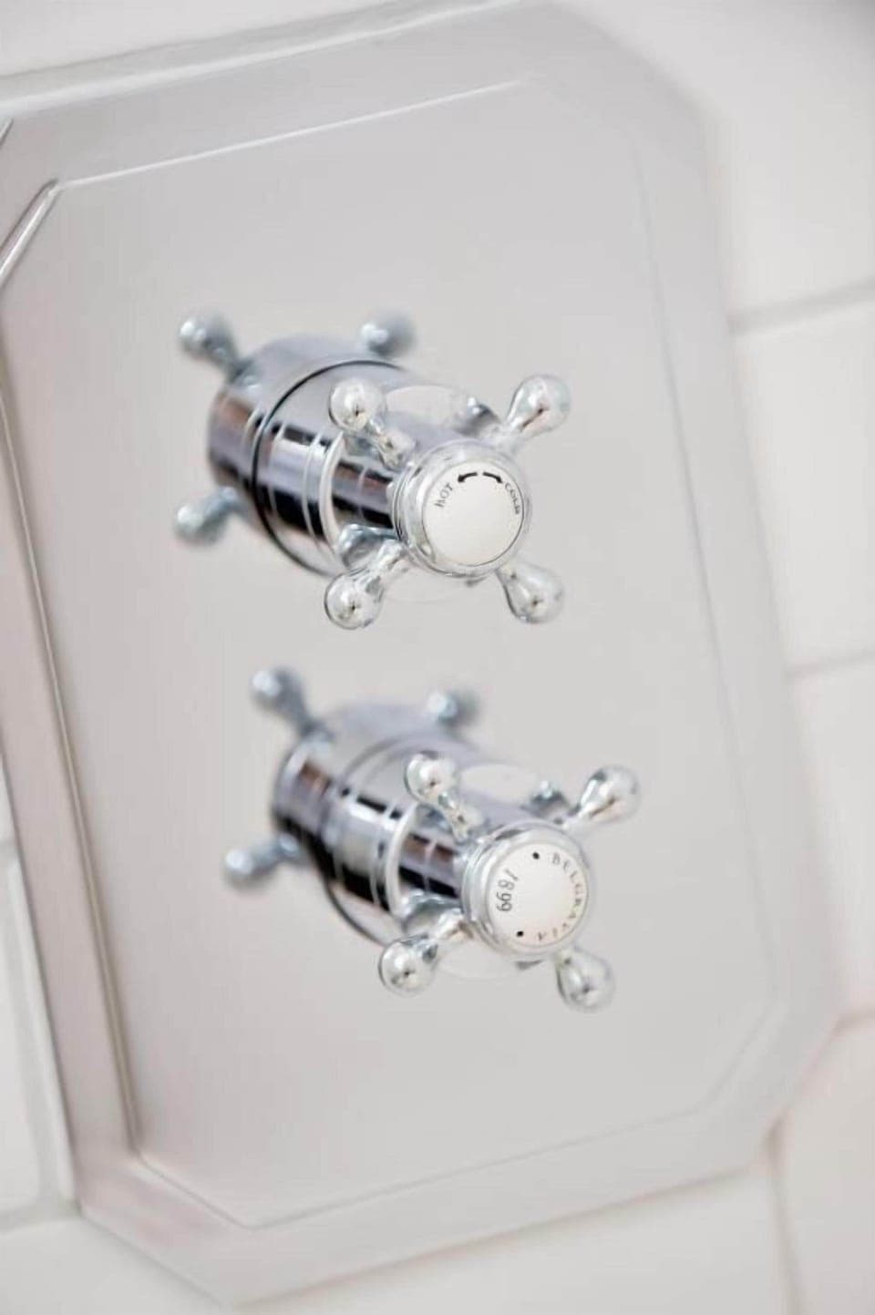 Designer toiletries, hair dryer, slippers, towels