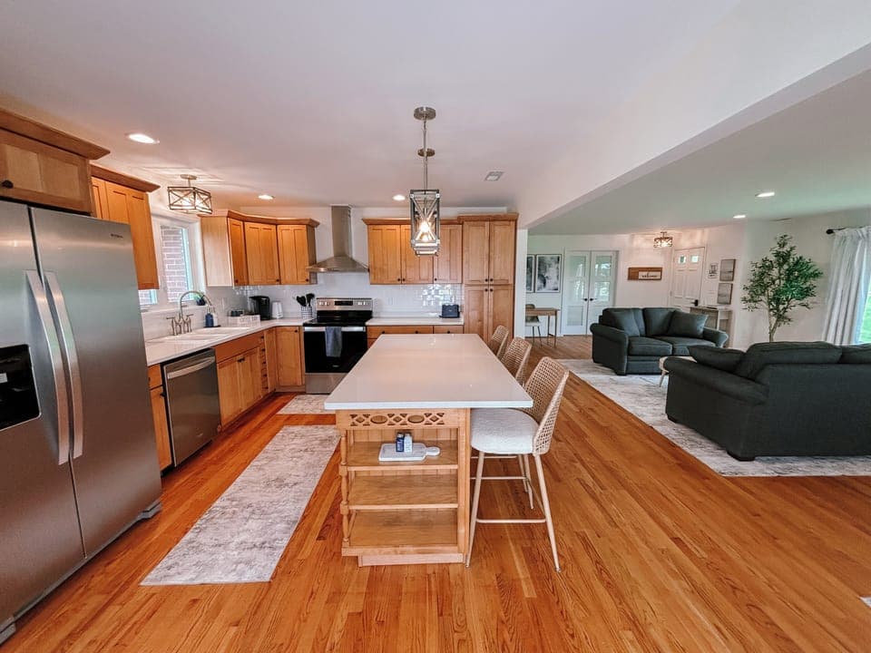 Entry into home w/ open concept kitchen, living, dining