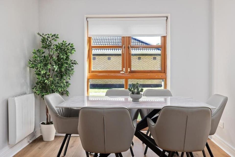 Sun-filled dining space for six with beautiful natural light and outdoor views.
