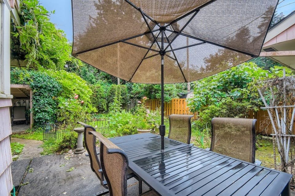 Outdoor furniture at the fenced backyard