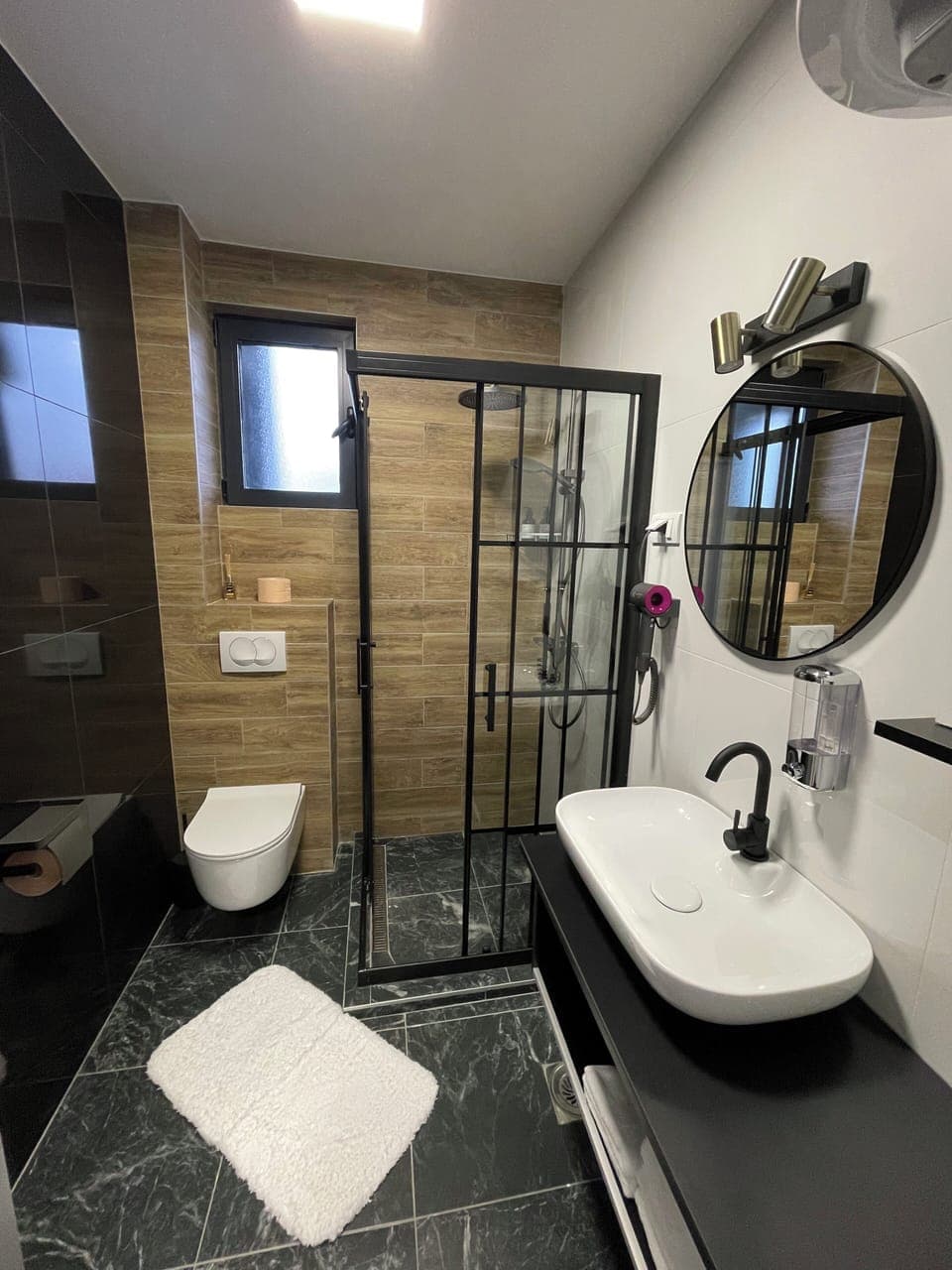 Shower, hair dryer, slippers, towels