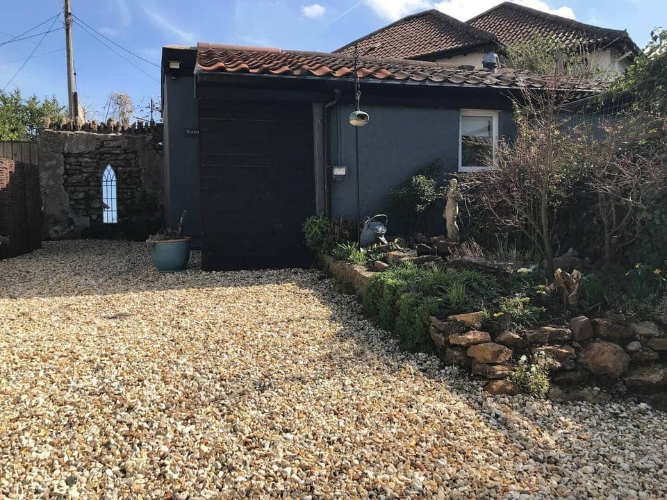Exterior of property showing courtyard and garden.