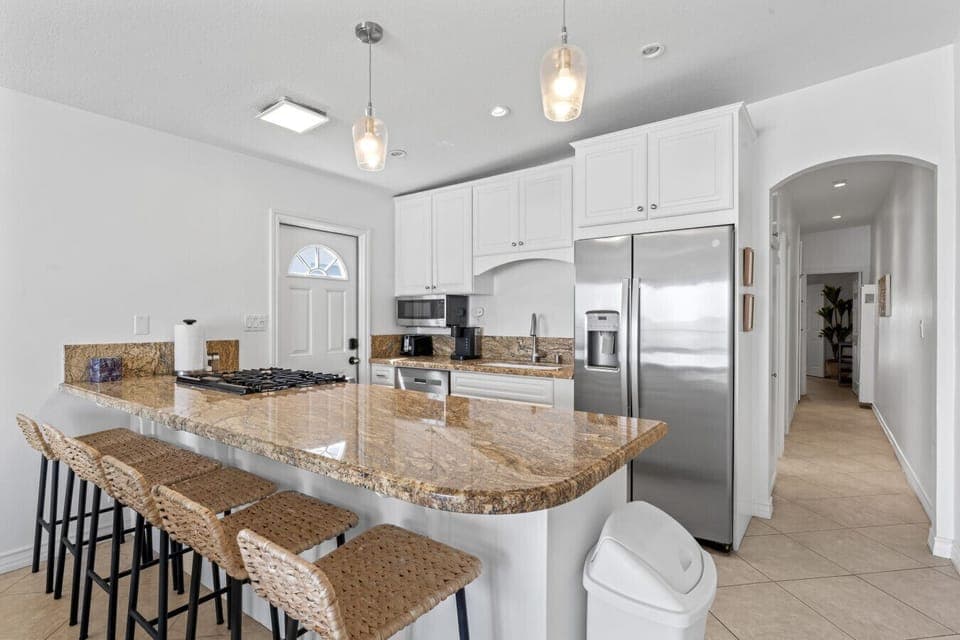 Elegant kitchen with a stunning granite countertop and modern appliances.