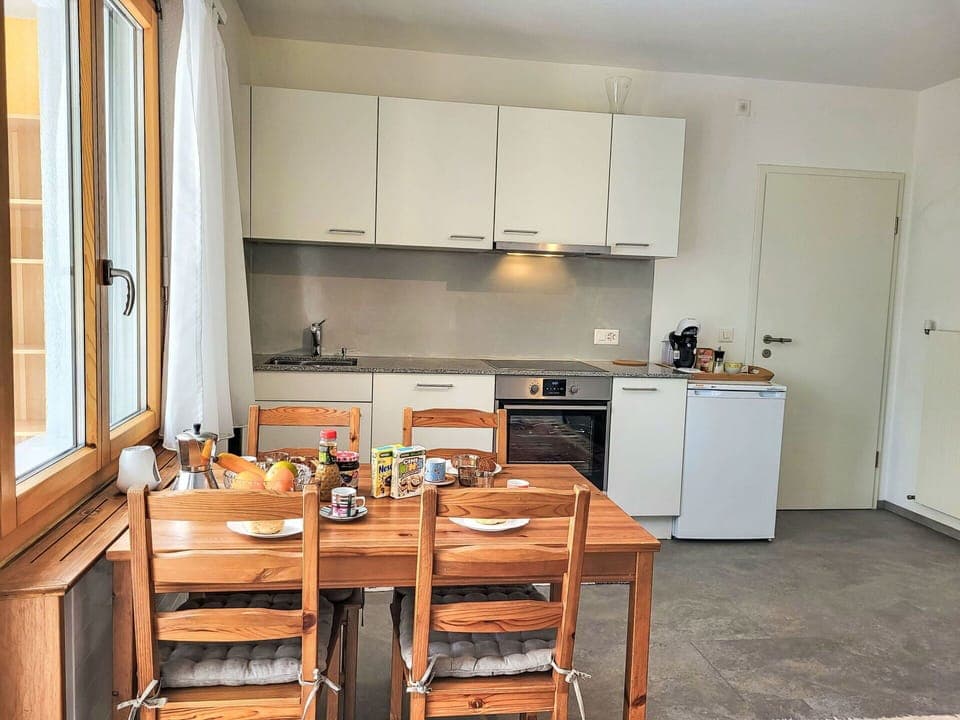 Furniture, Interior Design, Flooring, Kitchen, Floor, Wood, Major Appliance, Kitchen Appliance, Room, Cabinetry