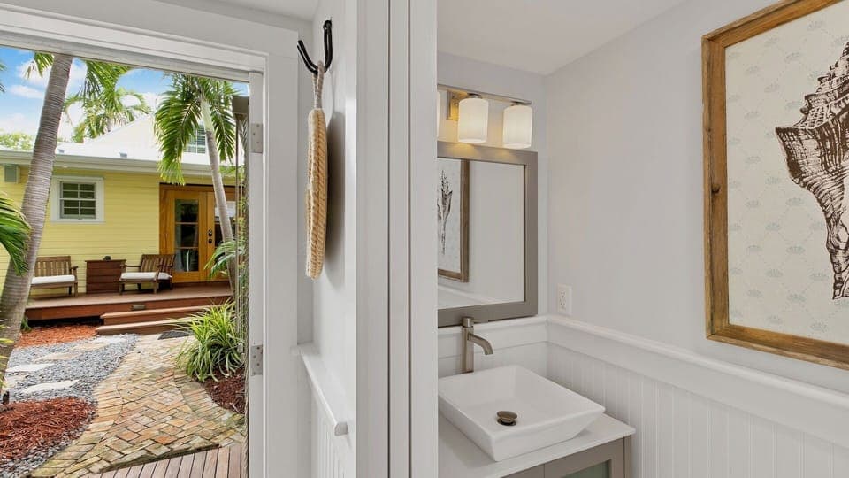 The Guest House has a half bath inside...