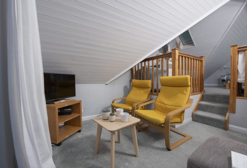 The Studio at Rockside, Polzeath: Sitting area with comfortable seating and a Smart television