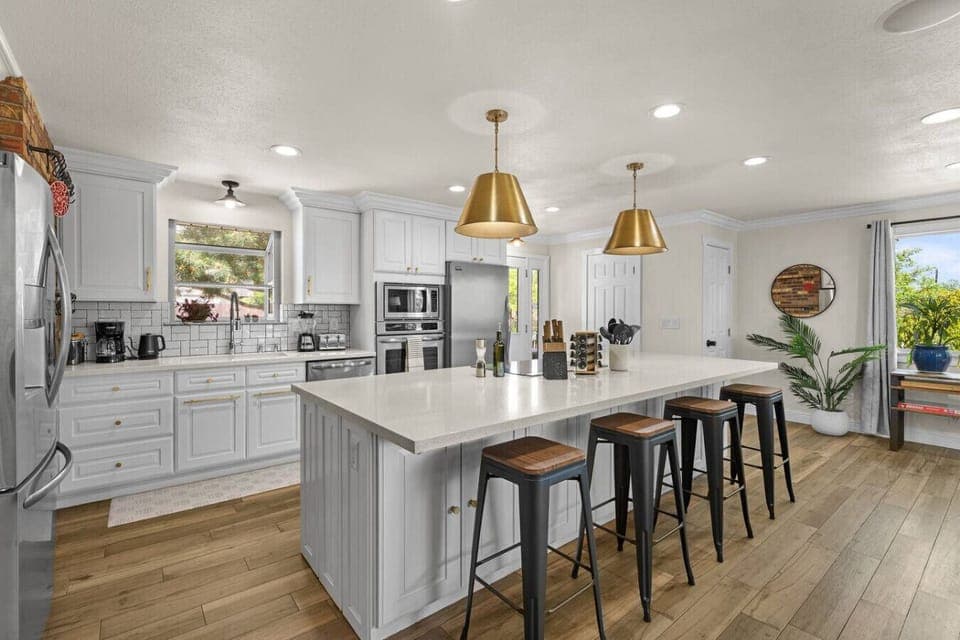 Chef’s dream meets cozy charm—cook, connect, and create memories in this beautifully designed kitchen with plenty of space for everyone to join in.