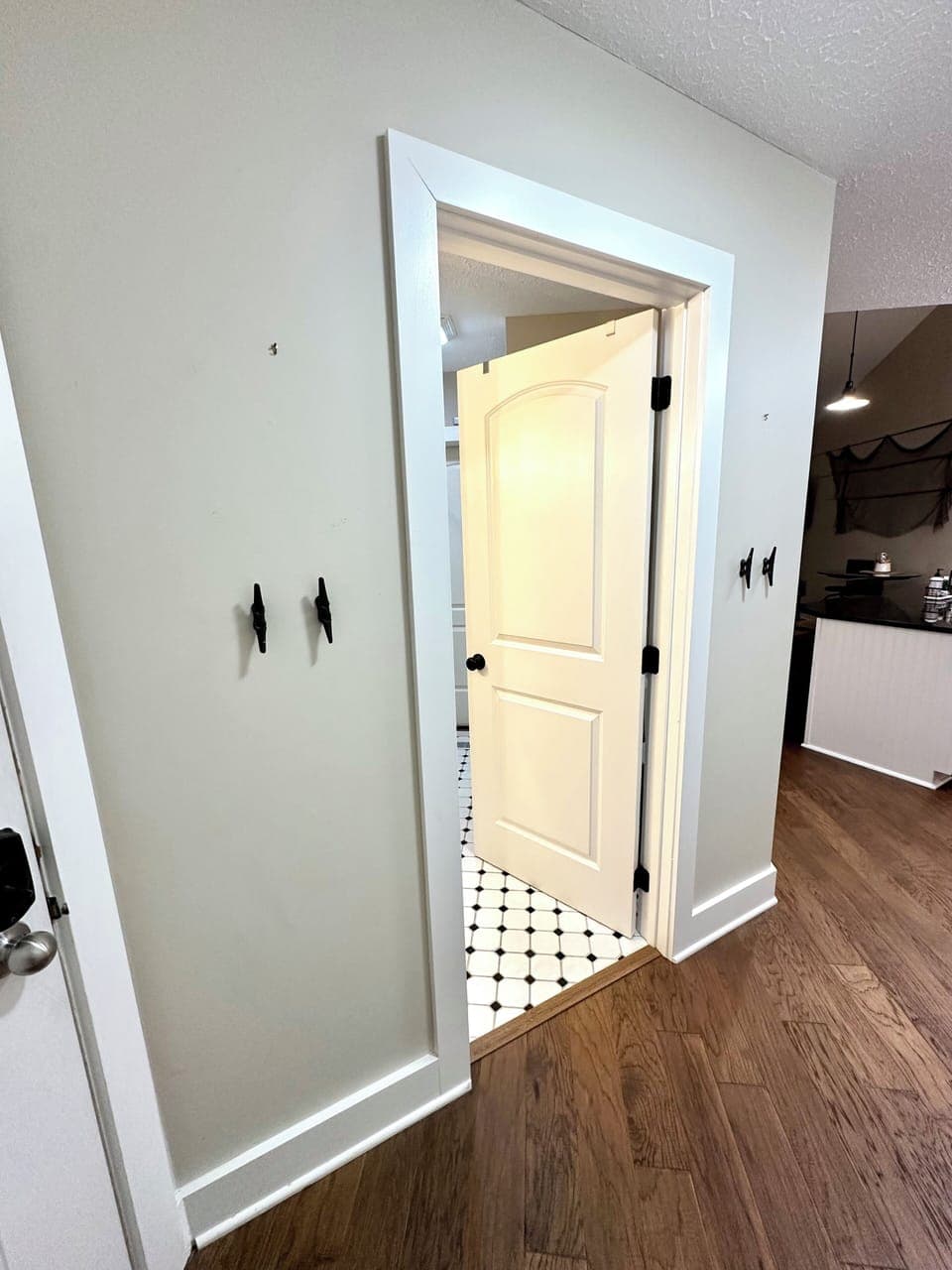 Entrance to bathroom to left of front door