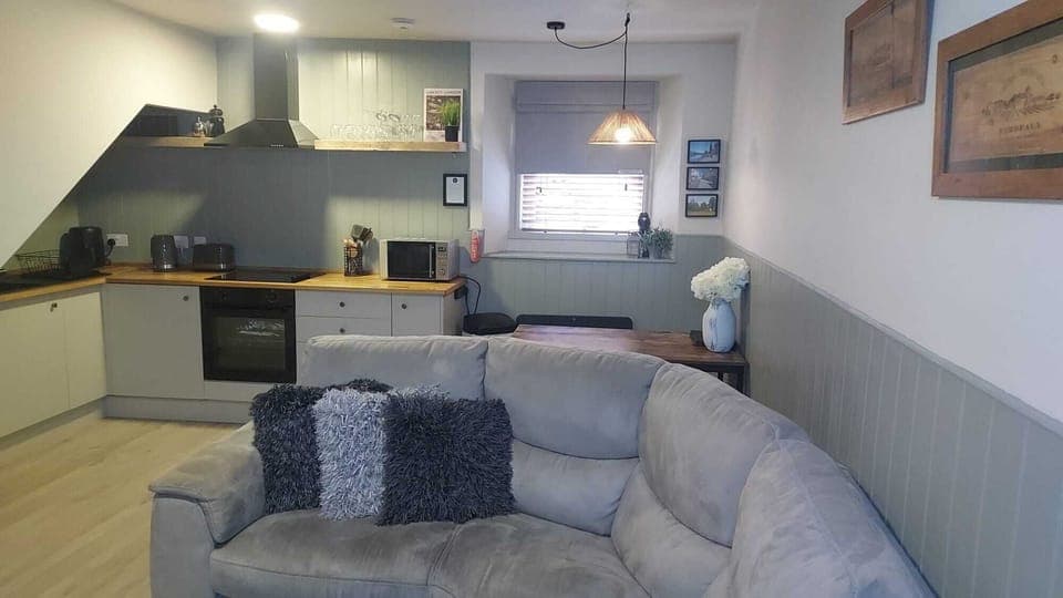 Relax on the corner sofa with plush cushions.