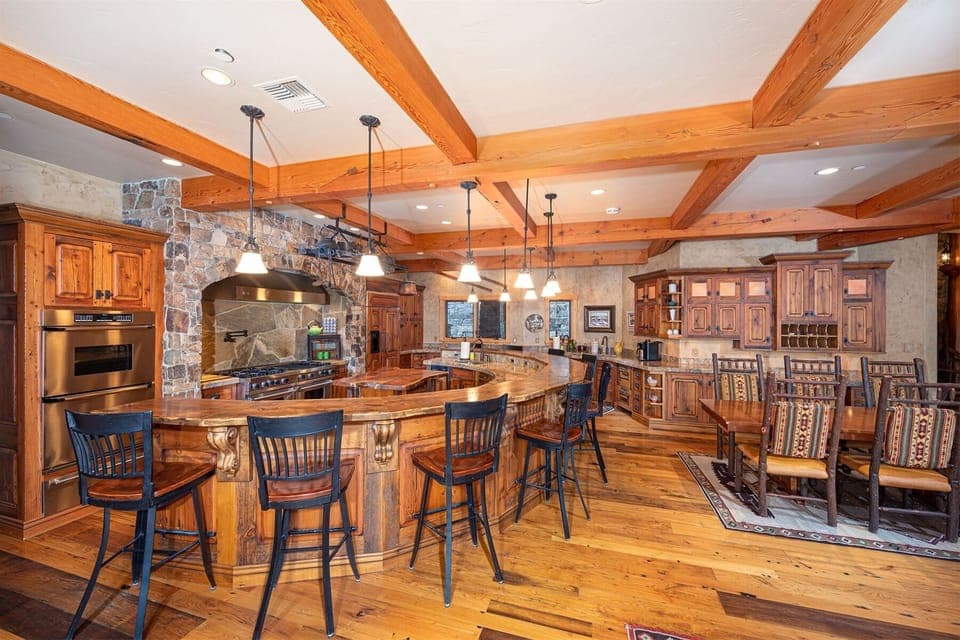 The kitchen features a commercial Viking stovetop with ovens plus two additional ovens - plenty of space to cook a feast | Main Level