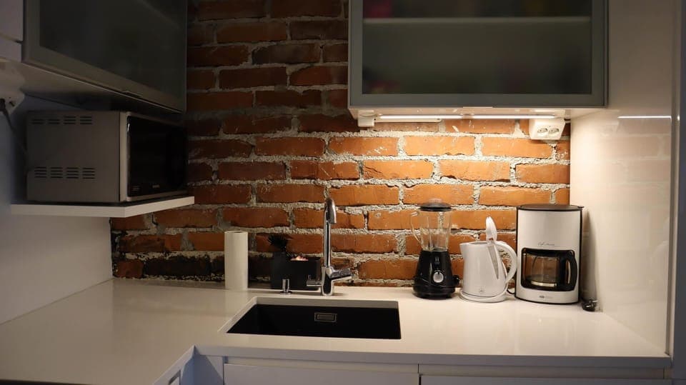 Deluxe Penthouse, Balcony, Courtyard View | Private kitchen | Electric kettle