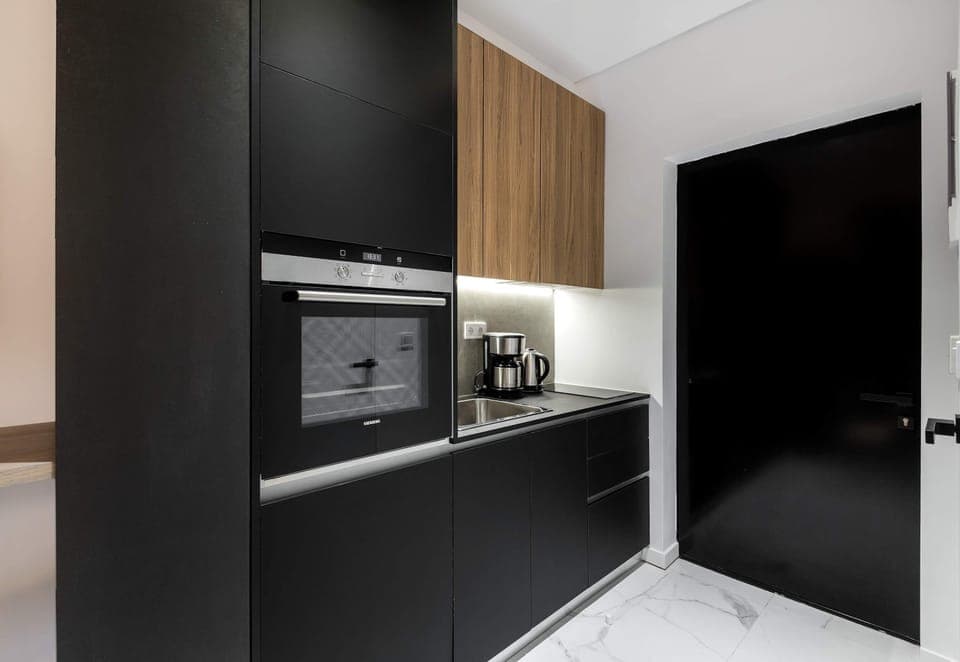 Streamlined modern kitchen setup makes quick meals easy between busy Athens adventures and outings.