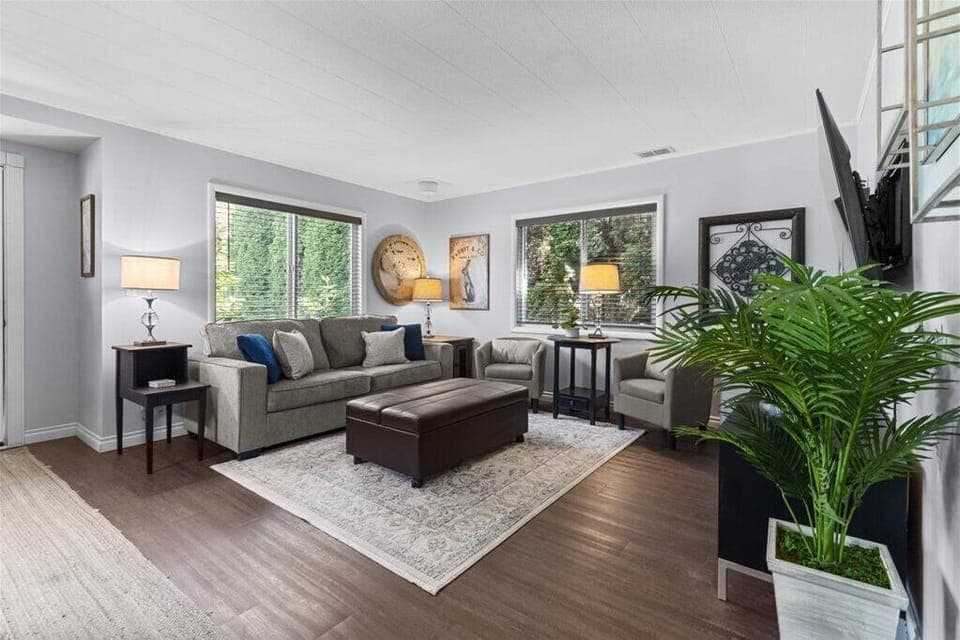 Main living area- Comfy full size pull out couch & twin pull out ottoman