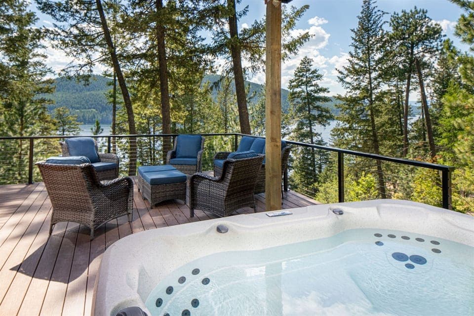 Enjoy the private hot tub and take in the Whitefish Lake views as you relax with your group | Exterior
