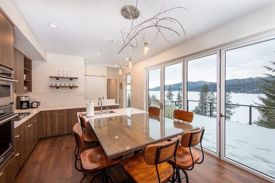 The dining area features custom wood table and hightop seating | Main Floor