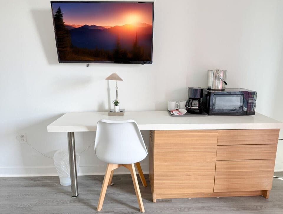 Functional workspace with Smart TV and modern decor.