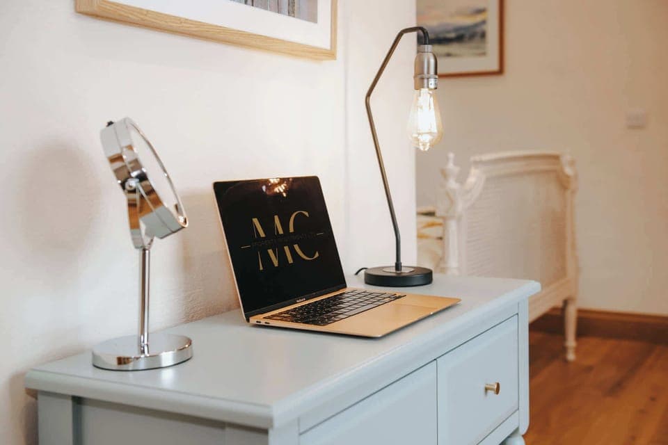 Dressing table & desk-space equipped with LED makeup mirror, desk lamp and charger sockets.