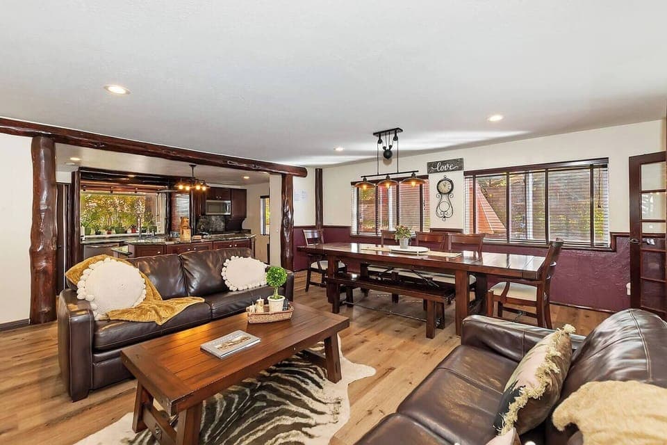 Open concept kitchen and dining with seating and Smart TV