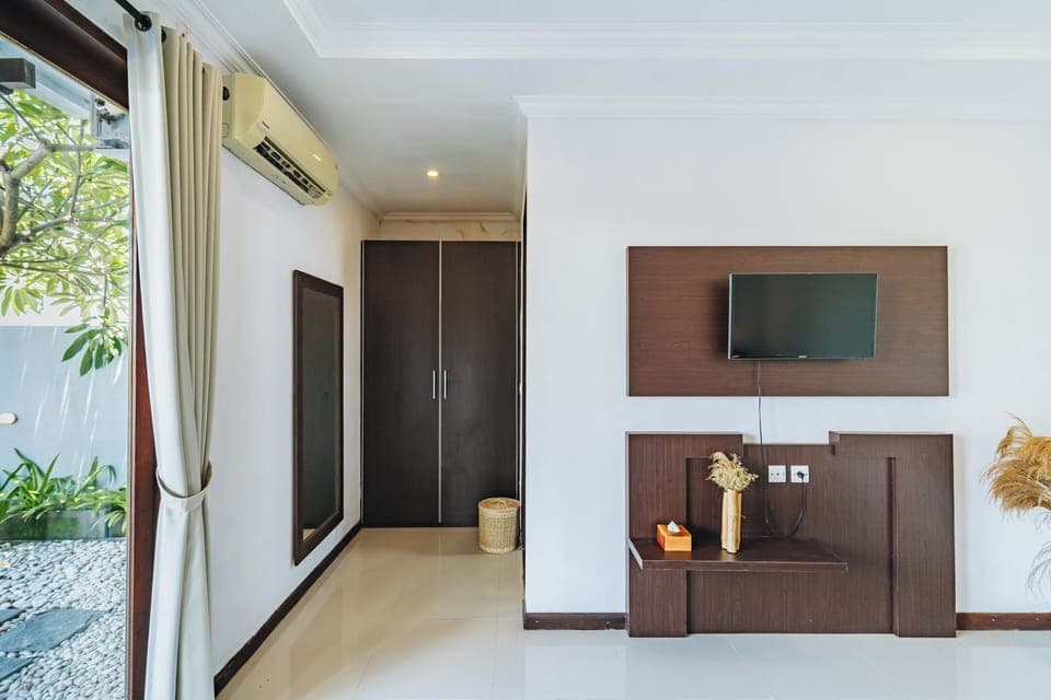 Spacious king bedroom with ensuite and flat-screen TV