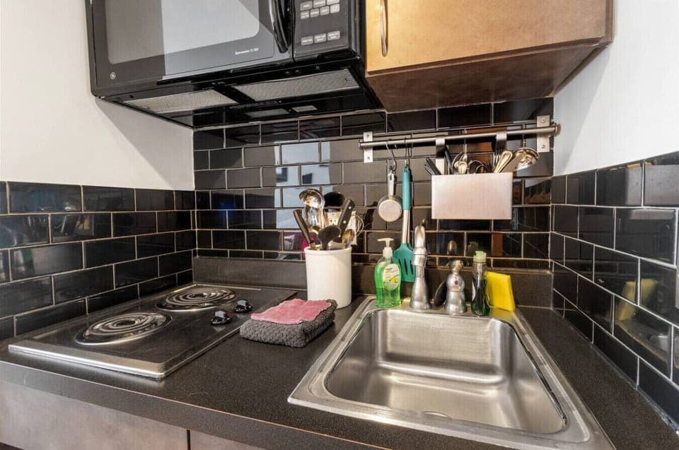 Kitchenette with 2 burner cooktop, microwave and mini fridge