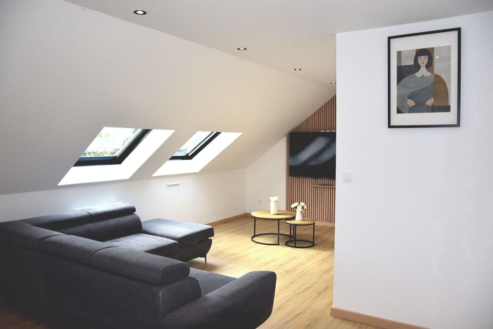 Deluxe Apartment | Living area | Flat-screen TV