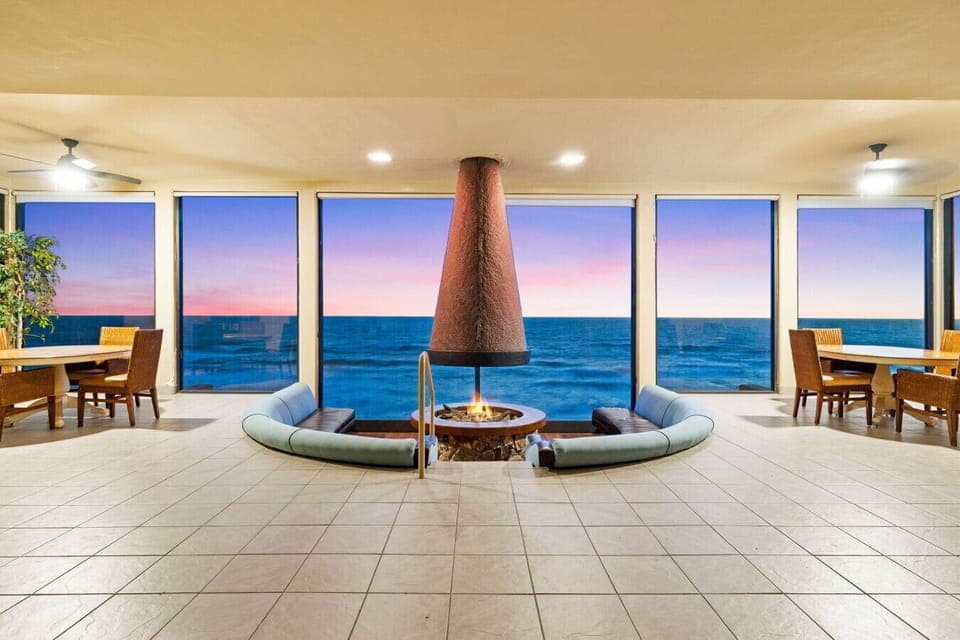 Oceanfront condo perks: cozy lounge, firepit, and sunset views 🌅🔥