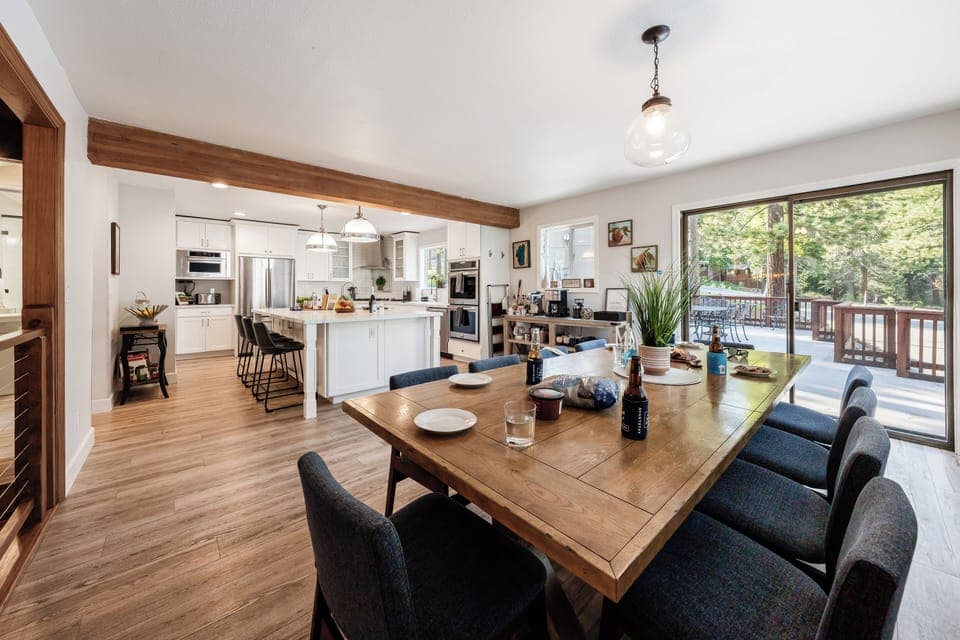 Dining area with seamless access to the deck for indoor-outdoor meals.