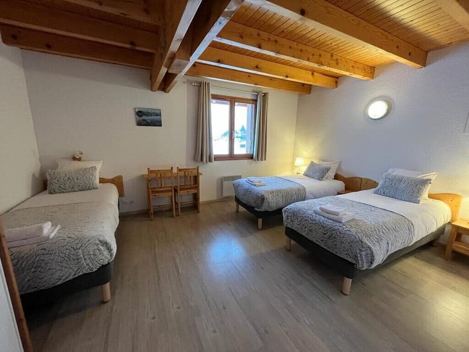 Chambre à trois lits