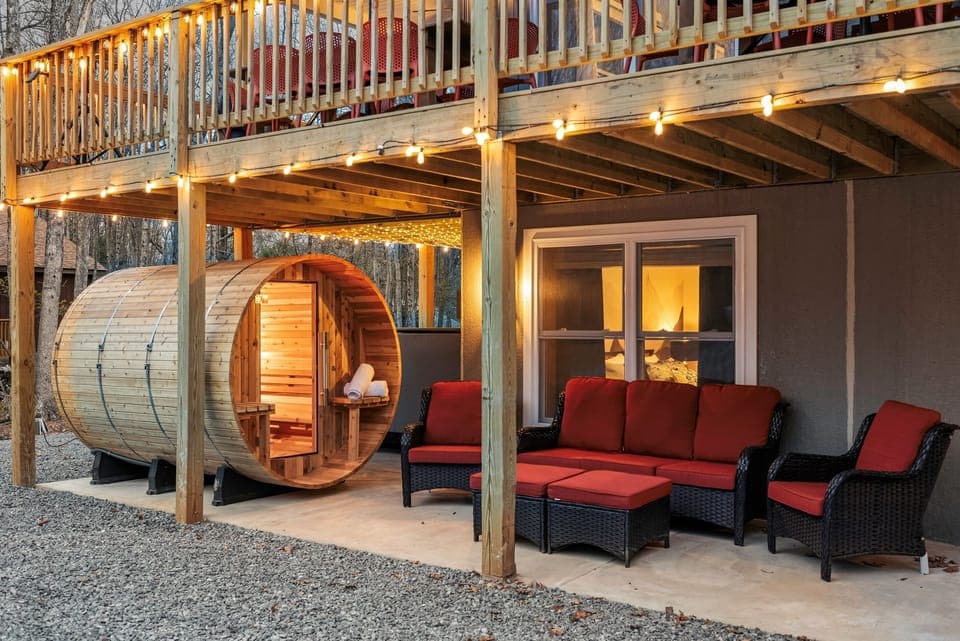 Outdoor Oasis: Unwind in style with comfy seating and a barrel sauna beneath the stars!